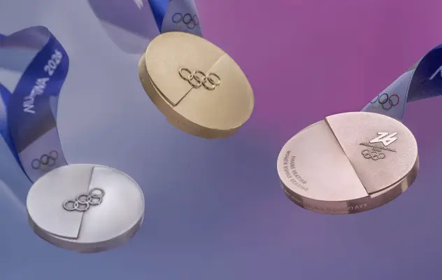 Three Olympic medals (silver, gold, and bronze) appear over a stylized purple background.
